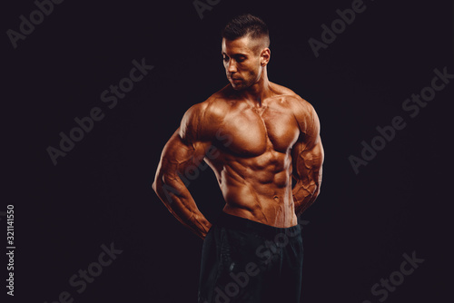 Strong Muscular Men Posing and Flexing Muscles