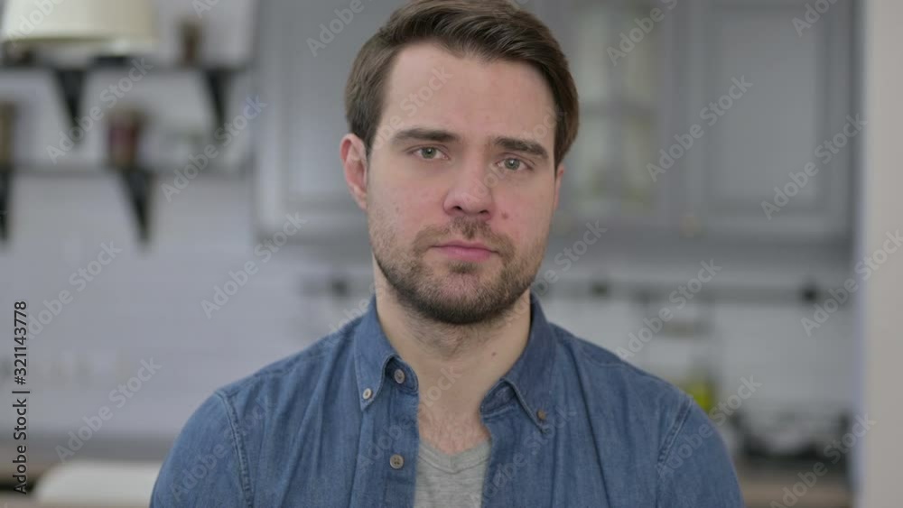 Portrait of Beard Young Man saying No by Head Sign Portrait of Beard Young Man saying No by Head Sign