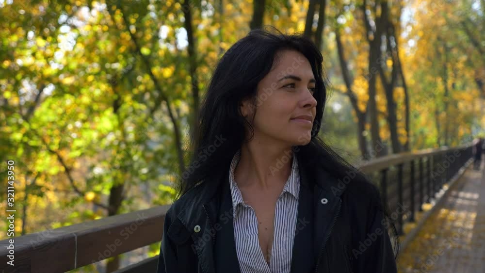 Romantic Pretty Girl Walking In City Park Looking At Trees Leaves. Autumn Sunny Morning. Slow motion 4K 60 fps Romantic Pretty Girl Walking In City Park Looking At Trees Leaves. Autumn Sunny Morning. Slow motion 4K 60 fps