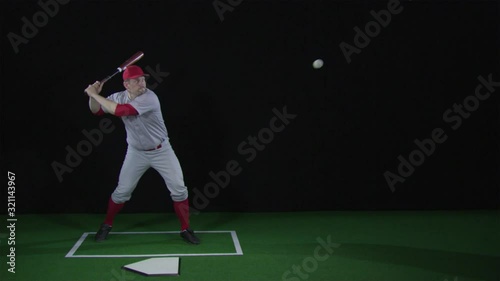 SLO MO, WS, Lockdown, baseball player hitting a baseball with a bat and running
