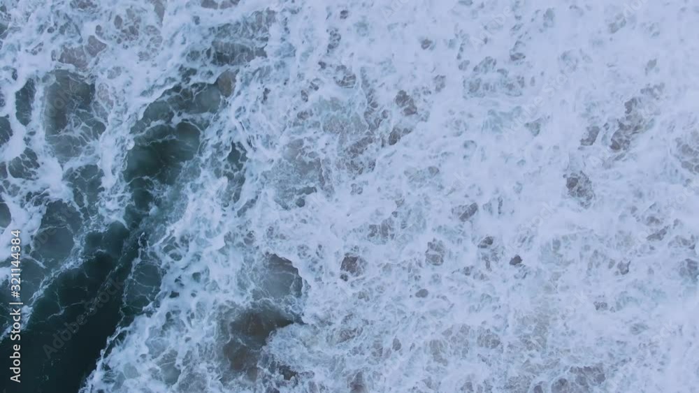 beautiful wave with heavy foam rolls on beach upper view beautiful wave with heavy foam rolls on beach upper view