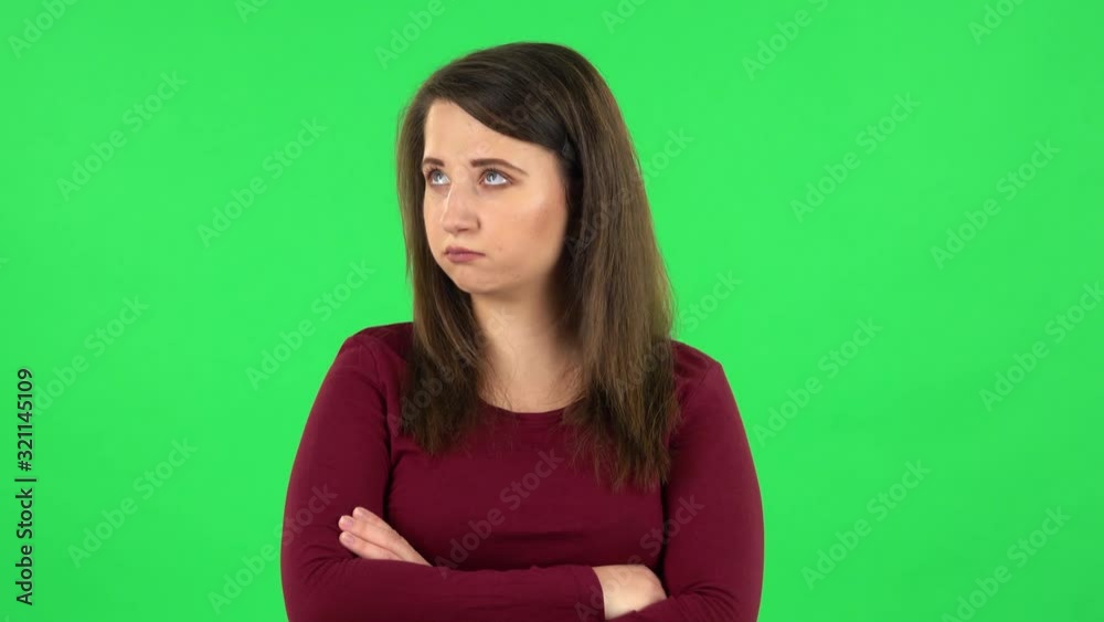 Portrait of pretty girl is very offended then smiles. Green screen Portrait of pretty girl is very offended then smiles. Green screen