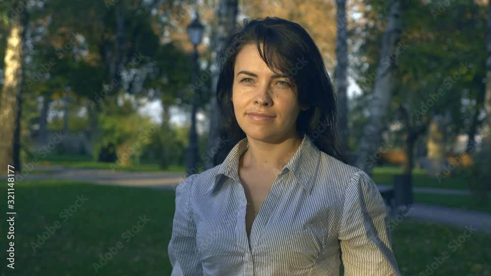 Portrait Beautiful Happy Woman Watching Sunset Smiling. Autumn Evening Golden Hour In Park Portrait Beautiful Happy Woman Watching Sunset Smiling. Autumn Evening Golden Hour In Park