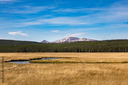 Meadow near Lewis Falls in Yellowstone National Park. View of mountains in distance. photo