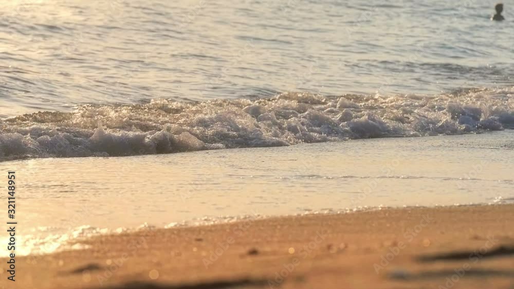 beach wave splashing macro in sunset beach wave splashing macro in sunset