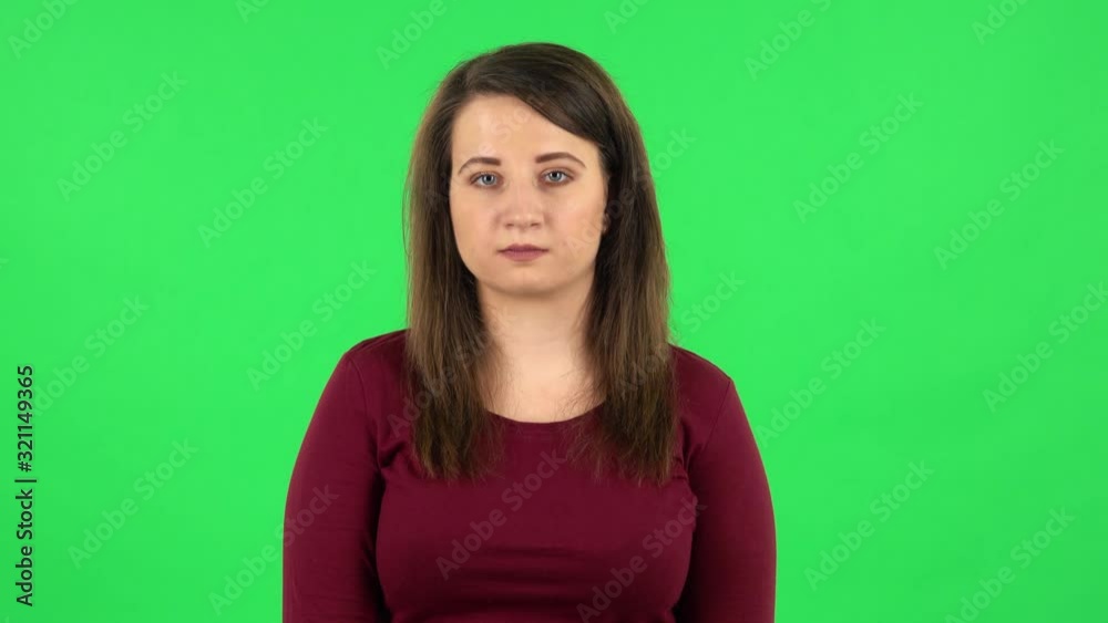 Portrait of pretty girl worrying in expectation then guilty hides her eyes. Green screen Portrait of pretty girl worrying in expectation then guilty hides her eyes. Green screen