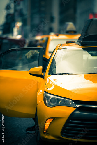 New York City Street scene with iconic yellow taxi cab © littleny