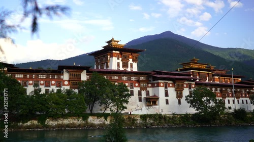 Temple and religious prayer flags in valley, Bhutan