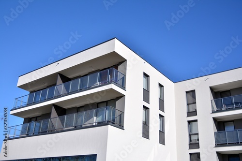 Contemporary residential building exterior in the daylight. Modern and new apartment building. 