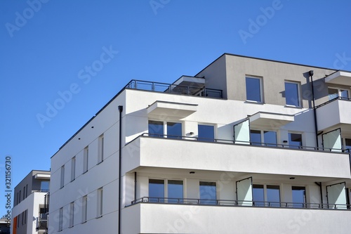 Contemporary residential building exterior in the daylight. Modern and new apartment building. 