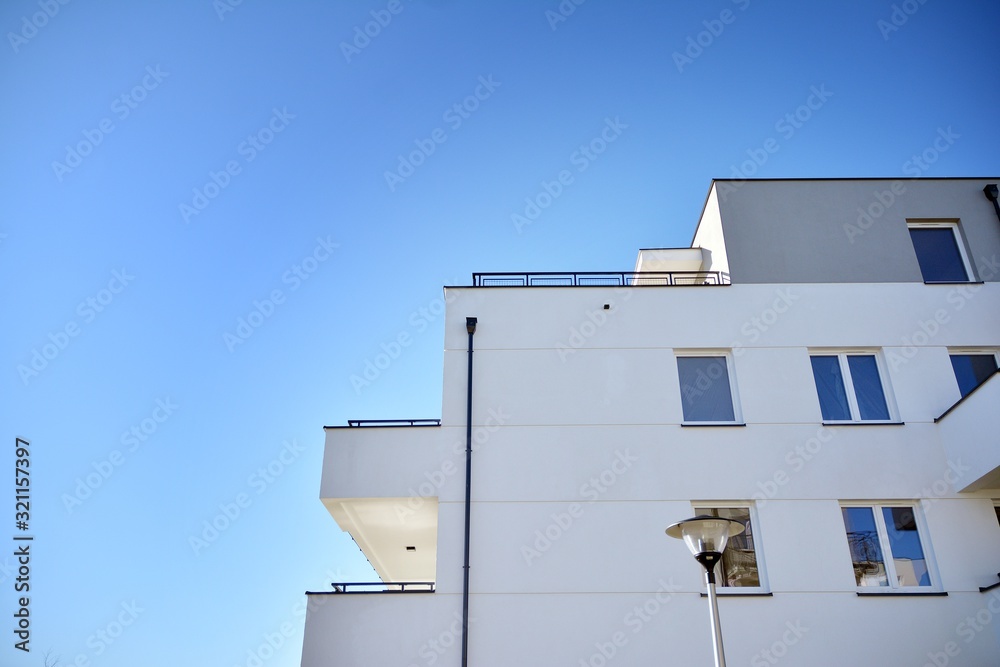 Contemporary residential building exterior in the daylight. Modern and new apartment building. Contemporary residential building exterior in the daylight. Modern and new apartment building.