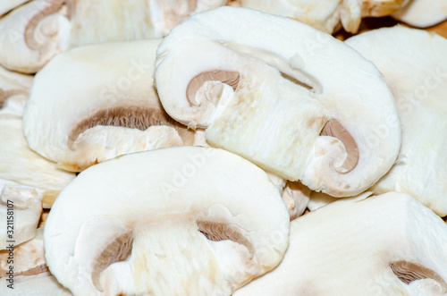Sliced champignon mushrooms, ingredient of many delicious culinary dishes