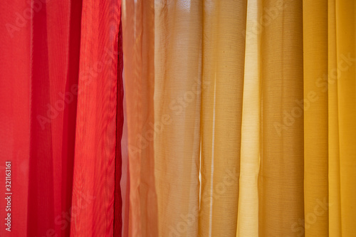 Dark red and orange and yellow background drapes vibrant colorful