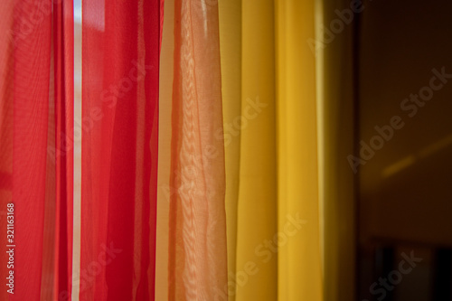 Dark red and orange and yellow background drapes vibrant colorful