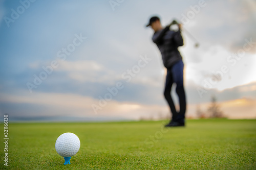 golfer precision strike sends out ball into a hole