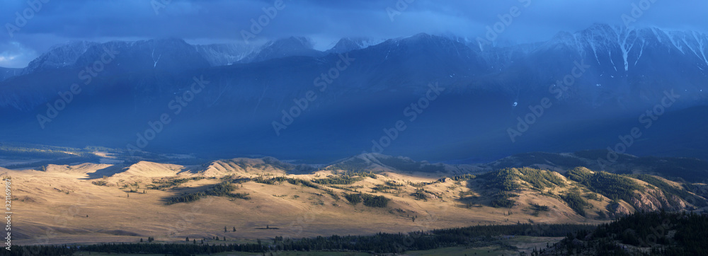 Sunset light in the mountains, thunder sky, panorama landscape, Altai