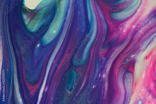 Obraz na płótnie This colorful macro photograph of an abstract acrylic pour painting features swirls of classic blue, metallic teal, neon pink, dark purple, black, and white for backgrounds.