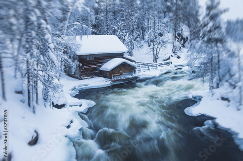 Winter snowy view of Oulanka National Park landscape, a finnish national park in the Northern Ostrobothnia and Lapland regions of Finland photo