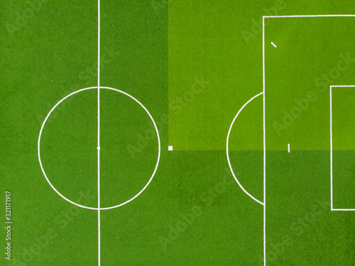 Texture of soccer field or soccer field. For design  top view. Green grass texture.
