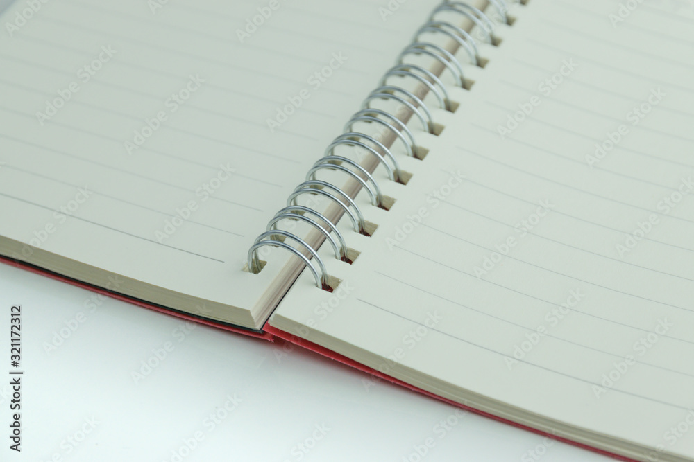 The notebook has lines placed on a white scene. The notebook has lines placed on a white scene.