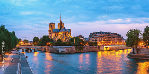 Paris France, panorama city skyline night at Notre Dame de Paris Cathedral and Seine River