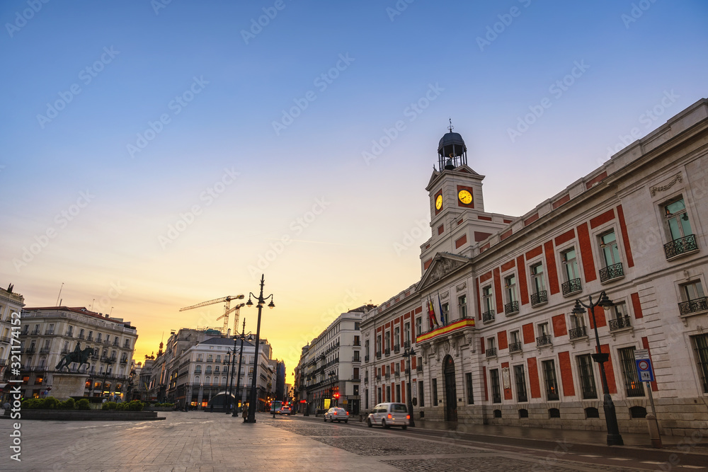 Madrid Spain, sunrise city skyline at Puerta del Sol and Clock Tower of Sun Gate