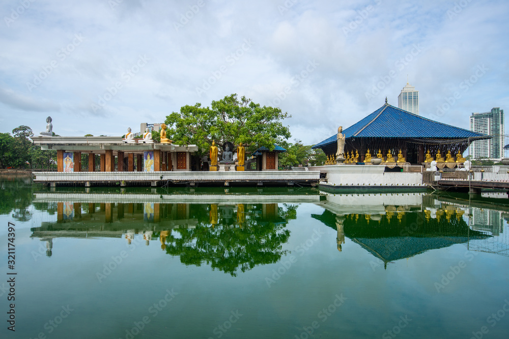 Beautiful reflection of Seema Malaka buddhist temple in the Beira Lake in Colombo, Sri Lanka. Seema Malaka temple is one of an iconic place in Colombo. Beautiful reflection of Seema Malaka buddhist temple in the Beira Lake in Colombo, Sri Lanka. Seema Malaka temple is one of an iconic place in Colombo.
