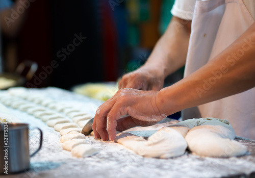 hands kneading dough