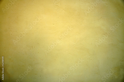 Texture of yellow cement wall , yellow background.