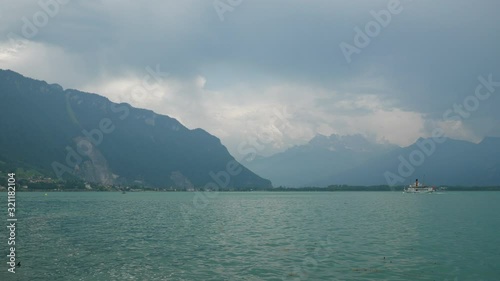 day time montreux city famous geneva lake famous ferry boat traffic mountain view slow motion panorama 4k switzerland photo