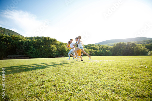 Wallpaper Mural A group of children are playing in nature. Torontodigital.ca