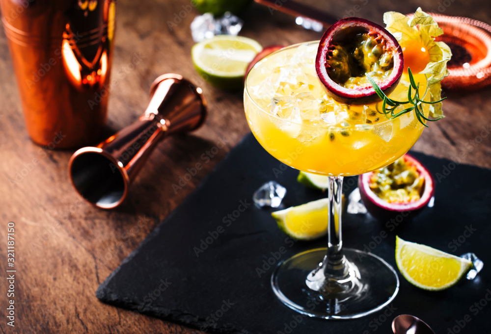Pure passion, alcoholic cocktail with syrup, lime, orange juice, soda, ice and passion fruit