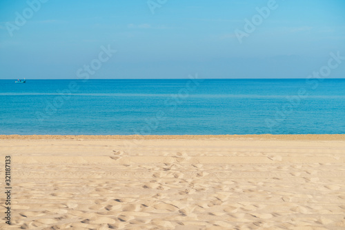 Tropical sea beach with sand  ocean and blue sky