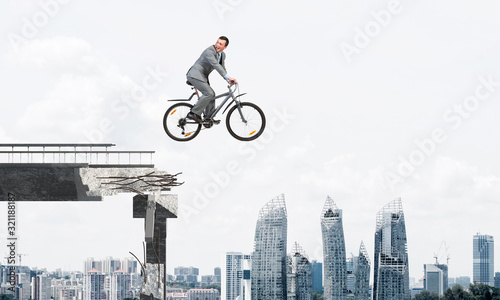 Businessman commuting to work by bike © adam121