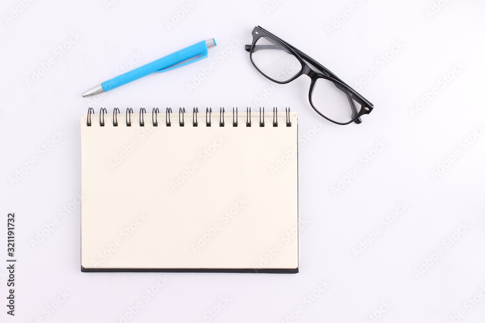 Top view blank notebook with pen on white background Top view blank notebook with pen on white background