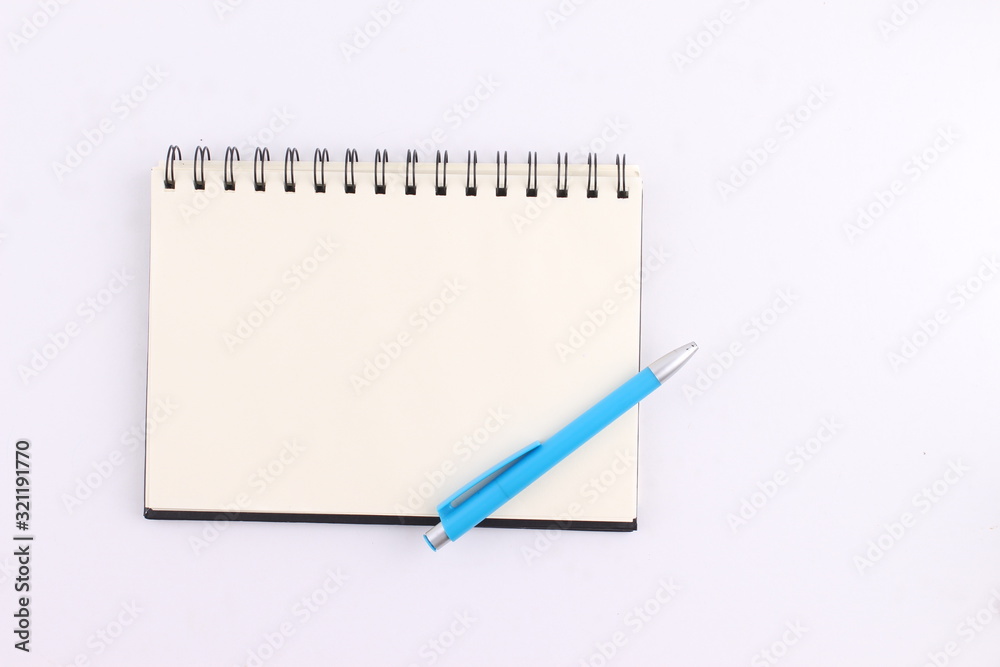 Top view blank notebook with pen on white background Top view blank notebook with pen on white background