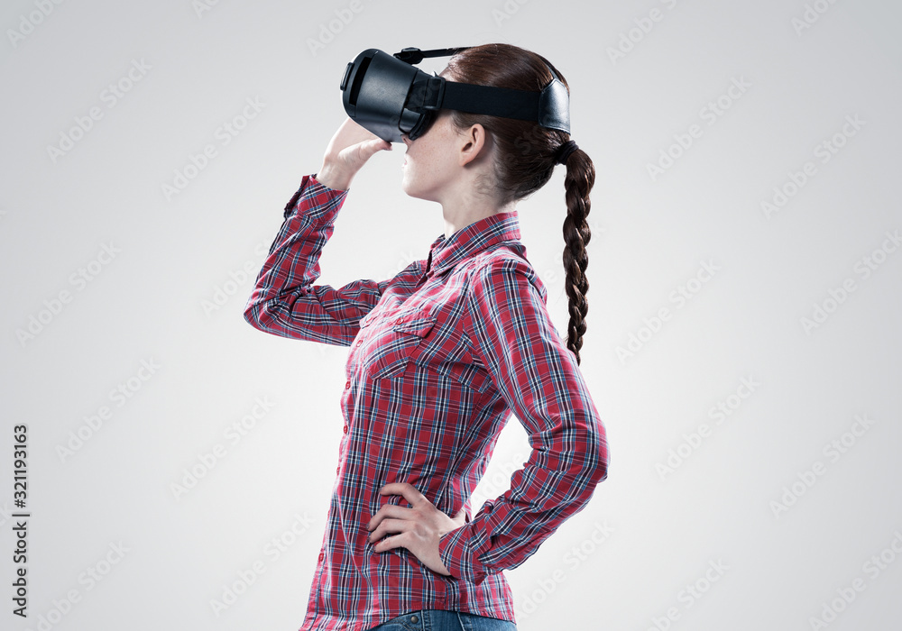Girl in mask experiencing virtual reality as new entertainment device Girl in mask experiencing virtual reality as new entertainment device