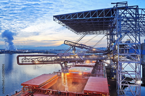 Night views of cargo terminal for loading grain cargo by shore cranes. Port Tacoma,WA, USA. October, 2019.