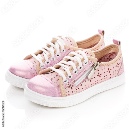 White with pink sneakers for girls isolated on white. Side view