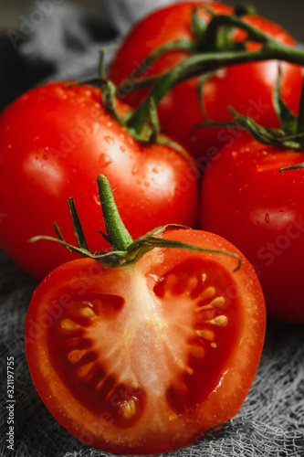 fresh tomatoes on wooden table