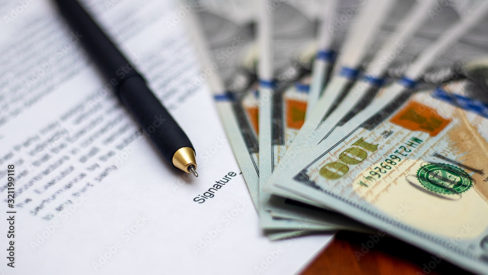 © Volodymyr - Document for signature  and dollars. Sale and purchase agreement_