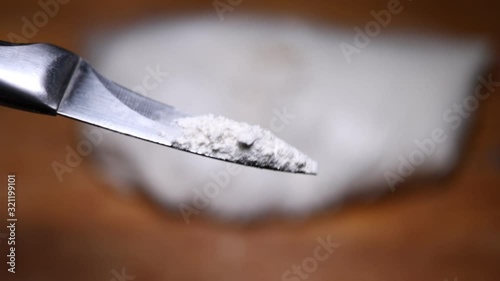 Cocain powder on a knife photo