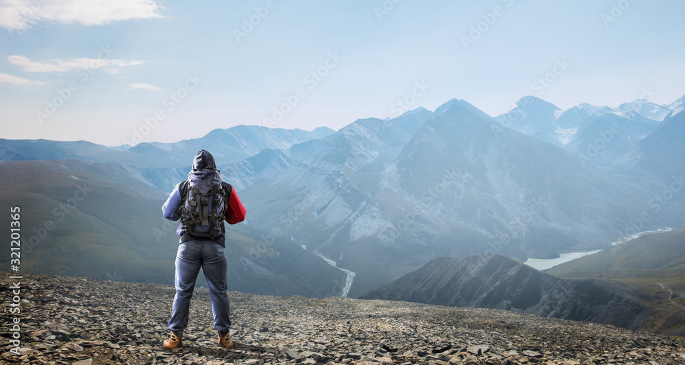 Hiker man in mountains. Mixed media