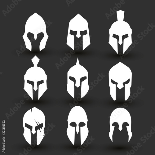 Silhouettes spartan helmet isolated from the black background. Vector set of roman or greek warrior helmet.