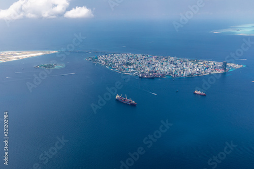 Canvastavla Male island, capital of Maldives with boats and ships