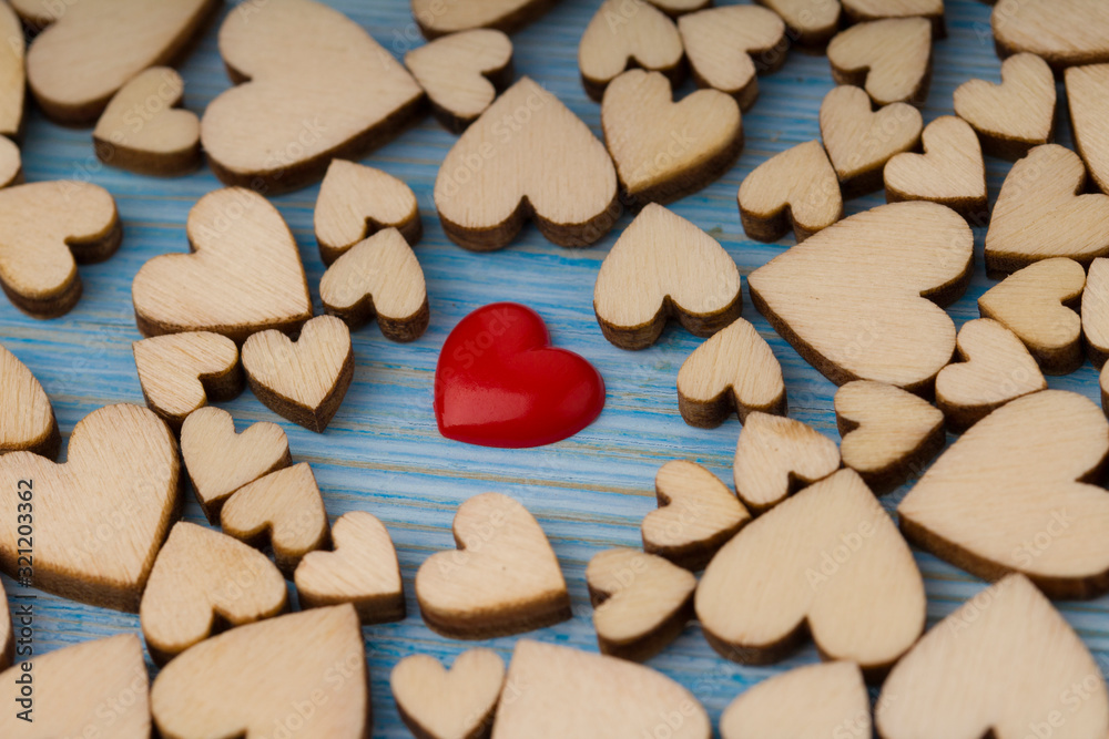 Many small wooden hearts on blue background. Backdrop for wedding cards or Valentine. Many small wooden hearts on blue background. Backdrop for wedding cards or Valentine.