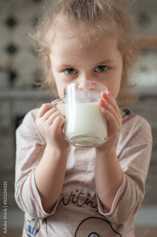 Portrait of a child with a cup of milk Portrait of a child with a cup of milk