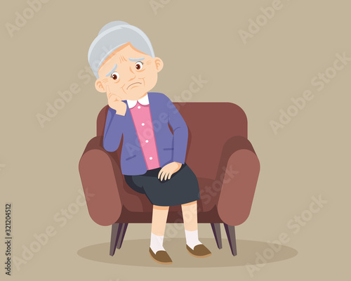 Senior woman sitting alone on sofa