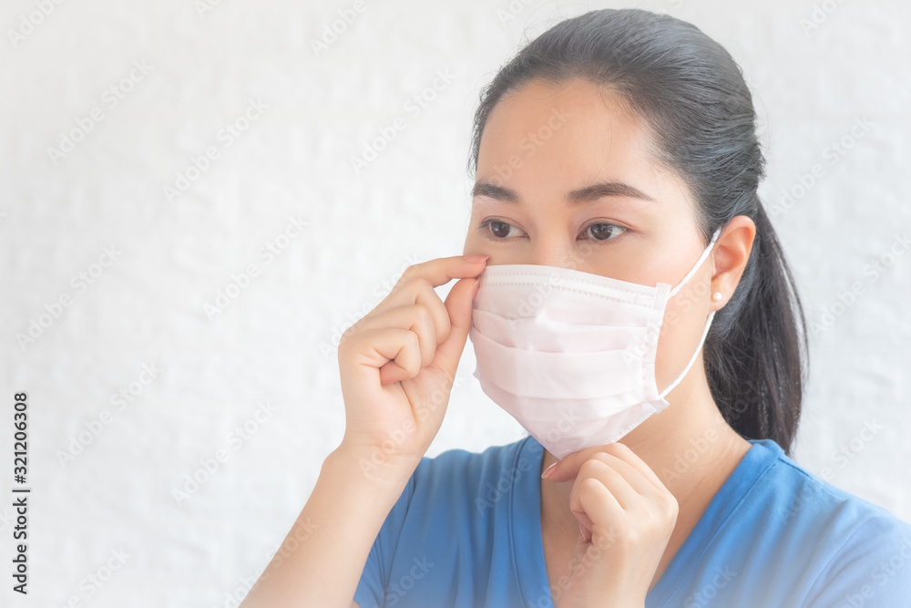 Asian woman wearing facial mask for protection from air pollution or virus epidemic on white background,Asian woman wearing face mask. Asian woman wearing facial mask for protection from air pollution or virus epidemic on white background,Asian woman wearing face mask.