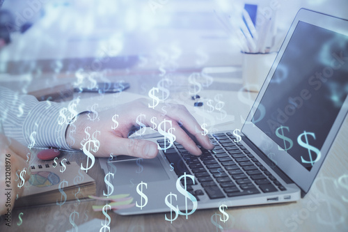 Double exposure of stock market graph with man working on laptop on background. Concept of financial analysis.